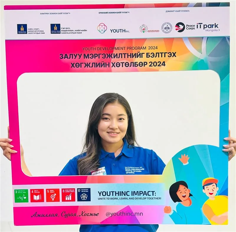 Participant holding a YDP 2024 photo frame